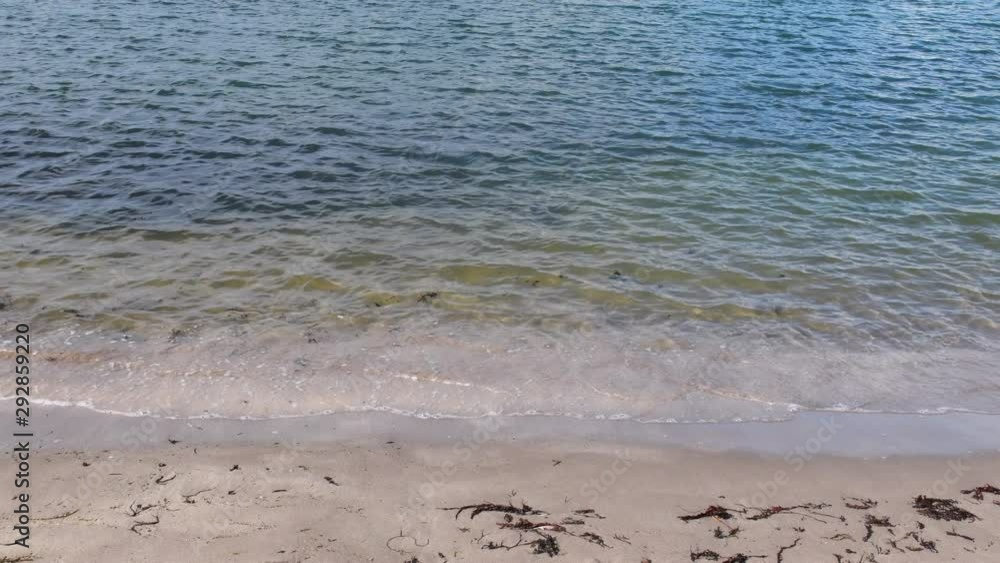Video sandy beach in Portpatrick in the south west of Scotland. Turquoise blue clear water of the Irish sea. Shoreline of Scottish holiday destination. 4K resolution. Video sandy beach in Portpatrick in the south west of Scotland. Turquoise blue clear water of the Irish sea. Shoreline of Scottish holiday destination. 4K resolution.