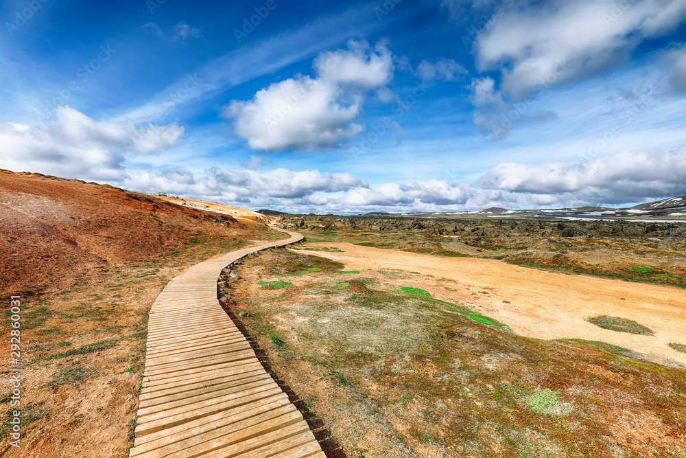 Tourist trail with wooden planks  in the geothermal valley Leirhnjukur