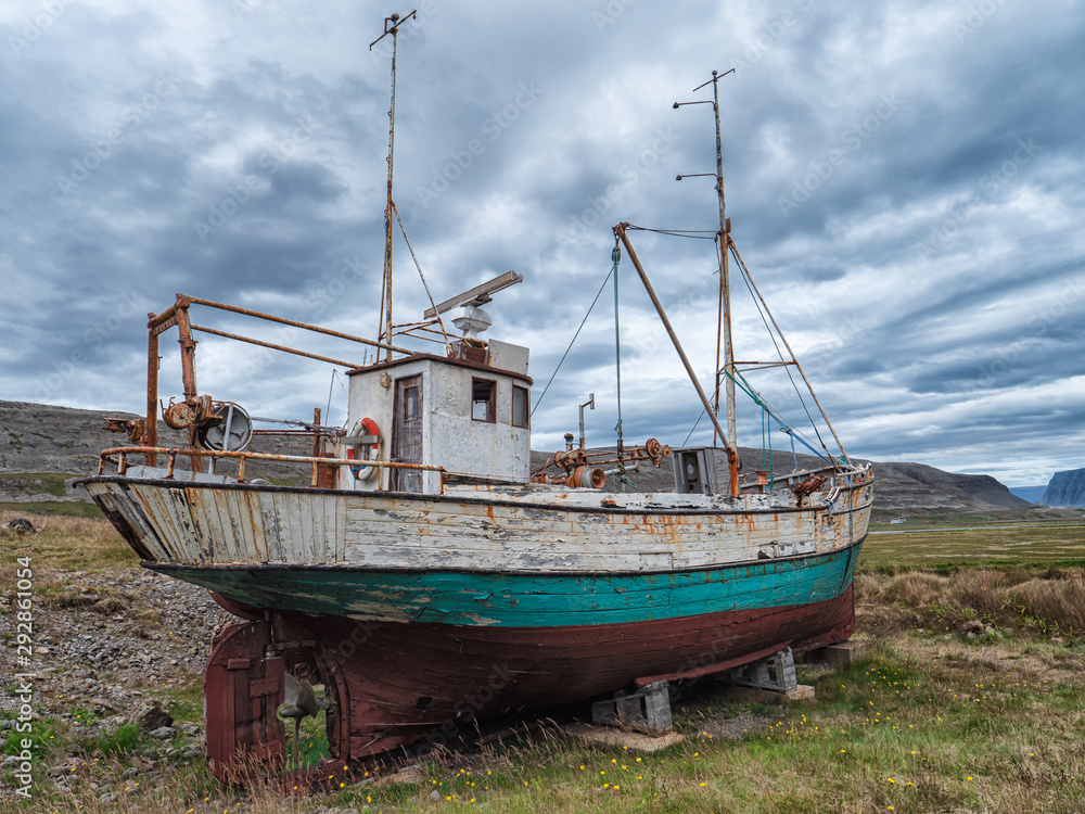Icelandic fishing boat used as a vehicle for finding fish parket on the beach