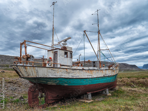 Icelandic fishing boat used as a vehicle for finding fish parket on the beach