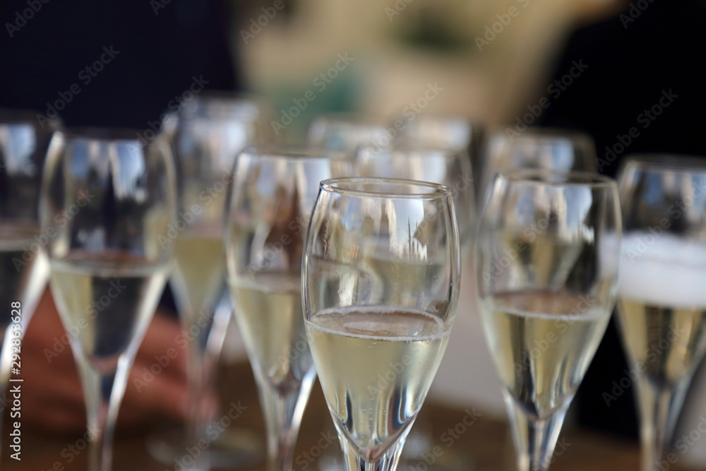 Glass glasses with prosecco - setting up the glasses on the table in the restaurant for an aperitif Glass glasses with prosecco - setting up the glasses on the table in the restaurant for an aperitif