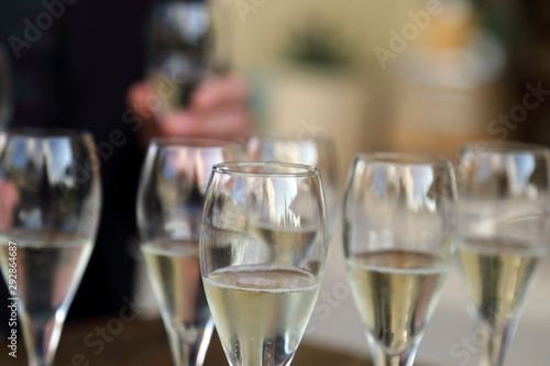 Glass glasses with prosecco - setting up the glasses on the table in the restaurant for an aperitif