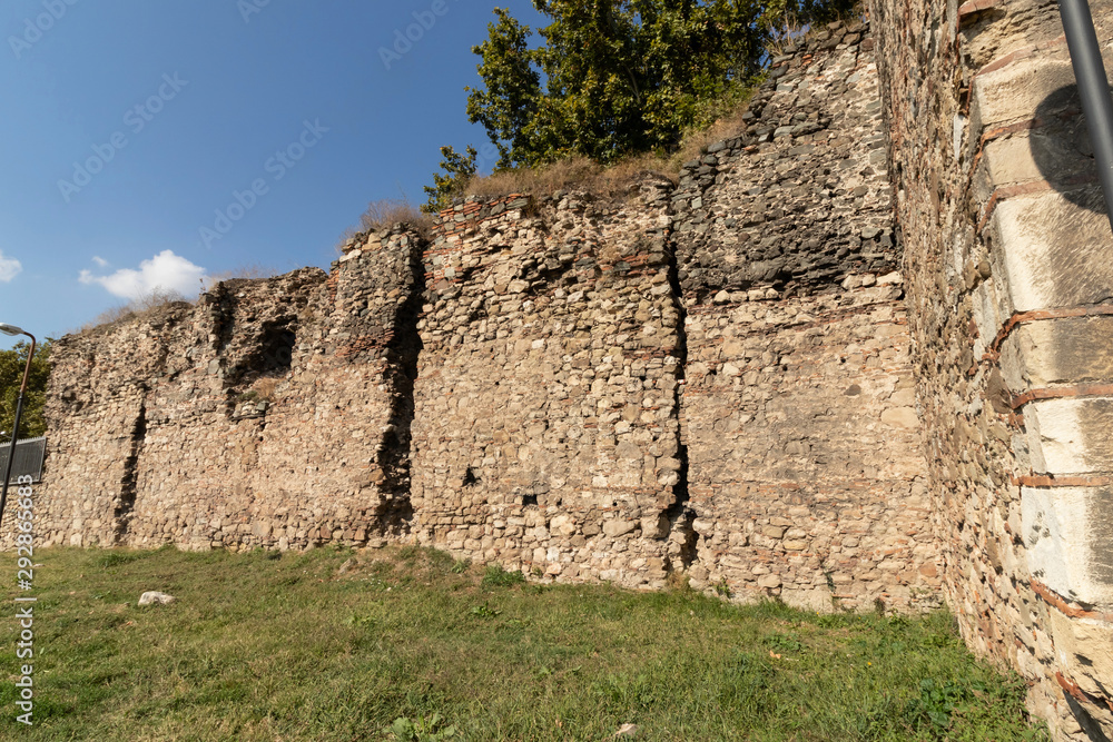 Fragment of the dilapidated fortress wall in the perimeter of th