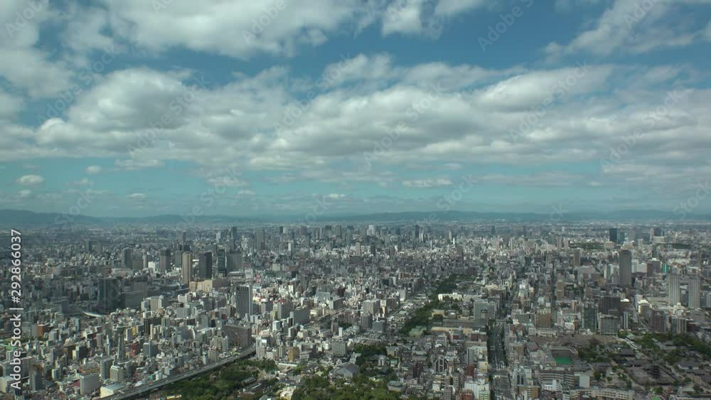 OSAKA, JAPAN - CIRCA SEPTEMBER 2019 : Aerial high angle view of CITYSCAPE of OSAKA in daytime. Osaka is the capital city of Osaka Prefecture and the second largest metropolitan area in Japan. OSAKA, JAPAN - CIRCA SEPTEMBER 2019 : Aerial high angle view of CITYSCAPE of OSAKA in daytime. Osaka is the capital city of Osaka Prefecture and the second largest metropolitan area in Japan.