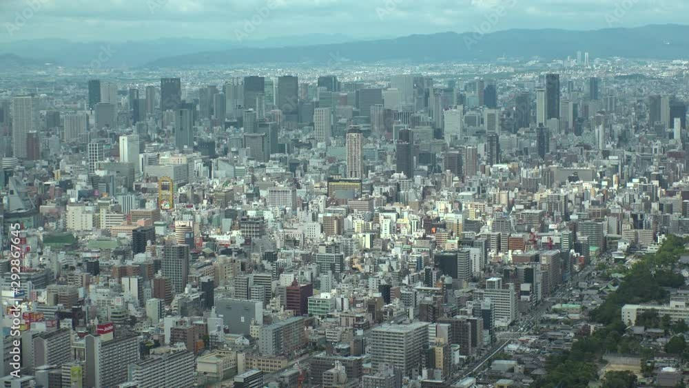 OSAKA, JAPAN - CIRCA SEPTEMBER 2019 : Aerial high angle view of CITYSCAPE of OSAKA in daytime. Osaka is the capital city of Osaka Prefecture and the second largest metropolitan area in Japan. OSAKA, JAPAN - CIRCA SEPTEMBER 2019 : Aerial high angle view of CITYSCAPE of OSAKA in daytime. Osaka is the capital city of Osaka Prefecture and the second largest metropolitan area in Japan.