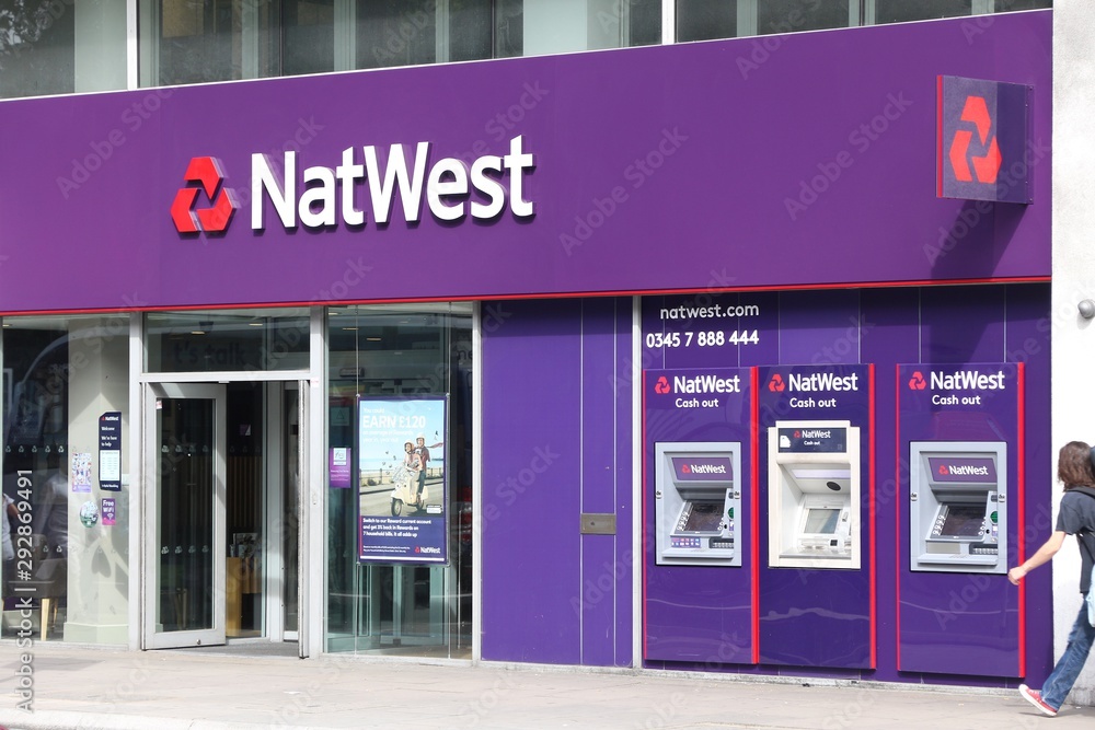LONDON, UK - JULY 6, 2016: Person walks by NatWest bank branch in London. National  Westminster Bank, known as NatWest is a large British bank with 1,400  branches. Stock-Foto | Adobe Stock
