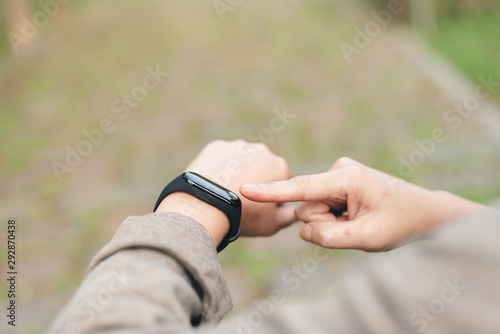 woman using smart watch