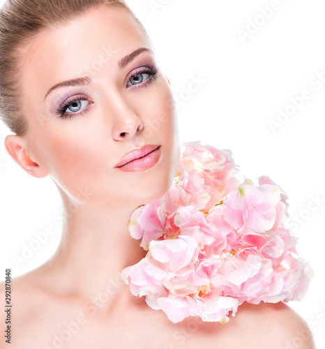 Portrait of young beautiful woman with a healthy clean skin of the face