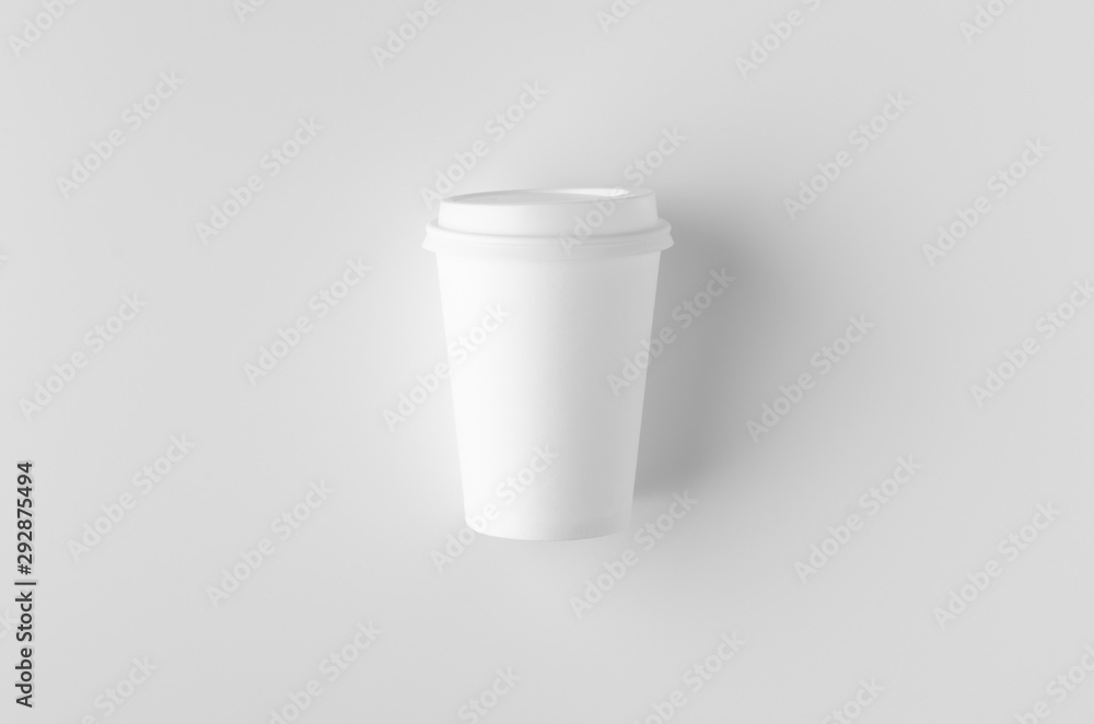 Top view of a 12 oz. white coffee paper cup mockup with lid. Top view of a 12 oz. white coffee paper cup mockup with lid.