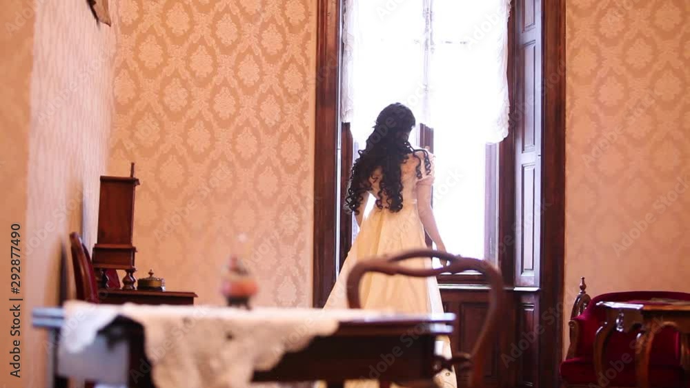 Beautiful Princess Standing By The Window Inside Her Castle Bedroom Beautiful Princess Standing By The Window Inside Her Castle Bedroom