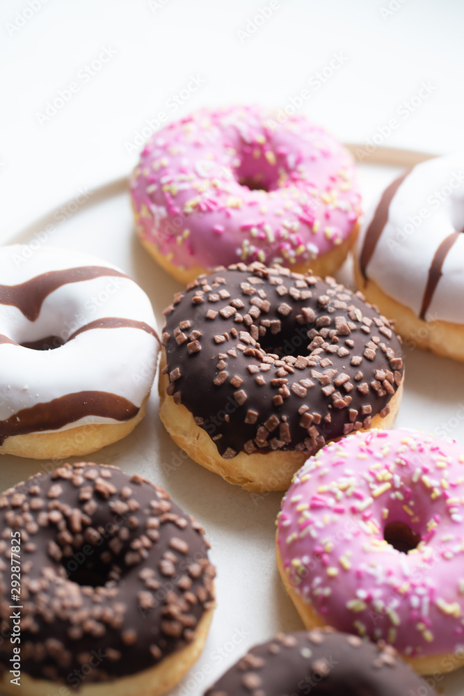 Colorful donuts on marble background with copy space Colorful donuts on marble background with copy space