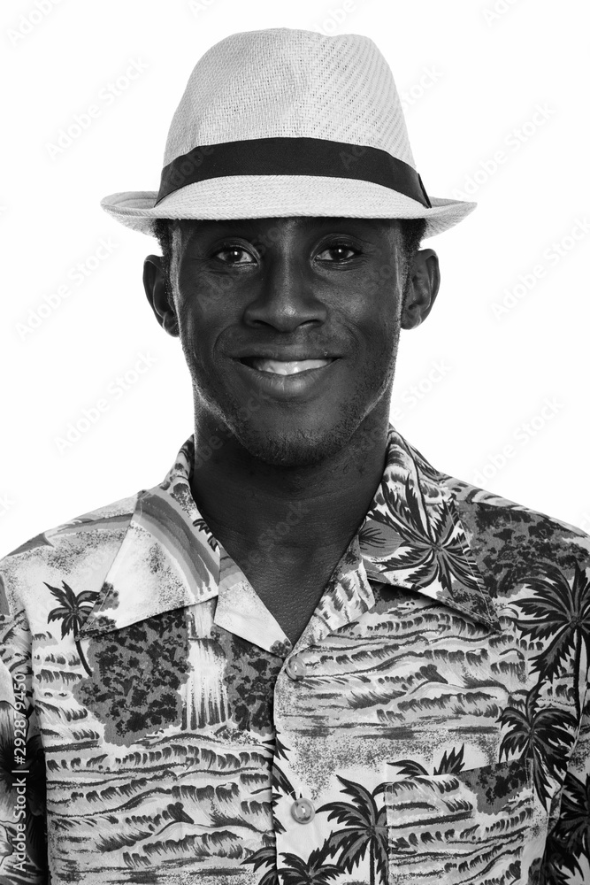 Face of young happy black African man smiling Face of young happy black African man smiling