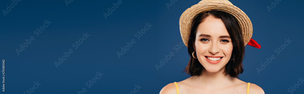 panoramic shot of happy smiling girl in straw hat isolated on blue panoramic shot of happy smiling girl in straw hat isolated on blue