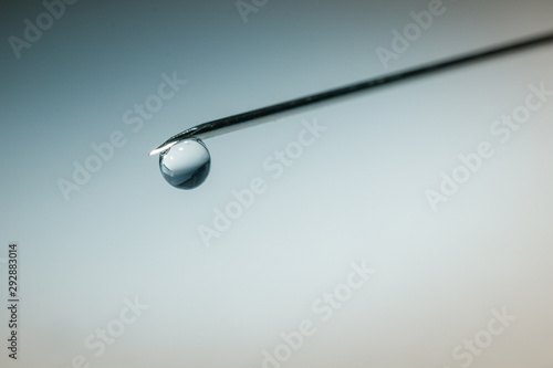 drop on tip of needle