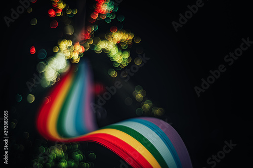 Beautiful abstract rainbow bridge and multi colored space background in the darkness. photo