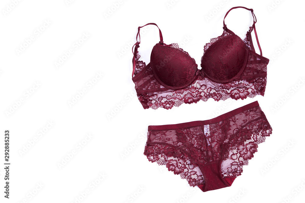 Beautiful lace lingerie on a white isolated background. Burgundy underwear  set. Bra and panties classic. Stock Photo
