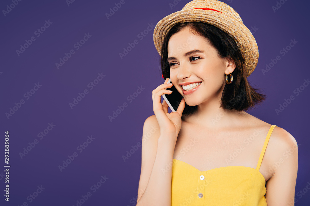 smiling girl in straw hat talking on smartphone isolated on purple smiling girl in straw hat talking on smartphone isolated on purple