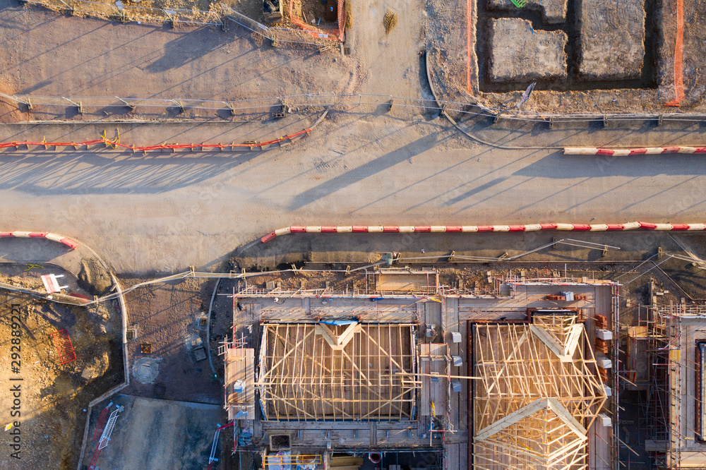 Obraz na plátně Aerial view over a construction site of new homes being built