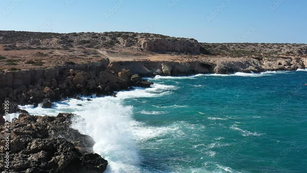Stony coast of the mediterranean island, view from drone, slow motion Stony coast of the mediterranean island, view from drone, slow motion