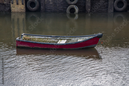 A small empty wooden rowing boat in Cornwall