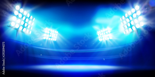 Stadium illuminated by floodlights. Stage on blue background. Abstract vector illustration. photo