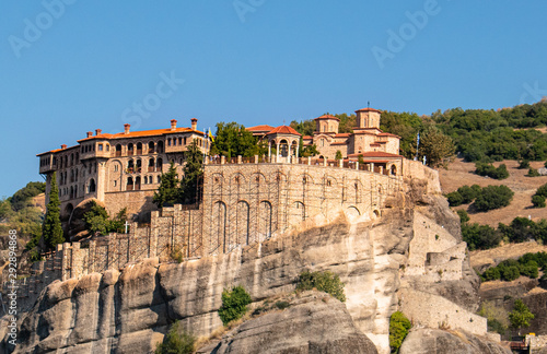 Monastery Meteora Greece. Stunning  panoramic landscape. View of mountains and green forest against epic blue sky with clouds. UNESCO heritage object. © Paraschiv