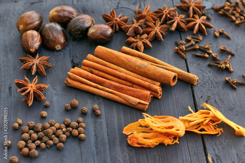 Brown spices on wooden background
