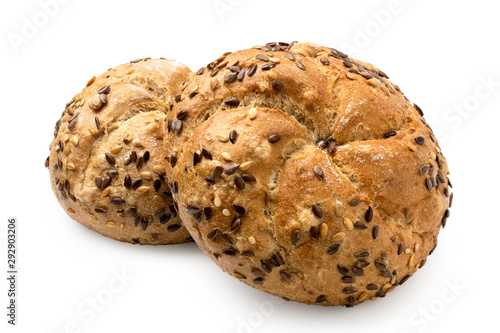 Two traditional whole wheat kaiser rolls with linseeds and sesame seeds isolated on white.