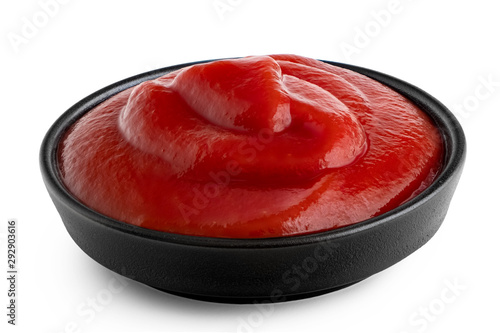 Cuadro en lienzo Tomato ketchup in small black ceramic dish isolated on white.