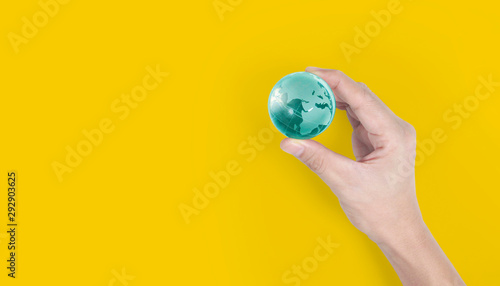 Globe  earth in  hand  holding our planet glowing. Earth image provided by Nasa