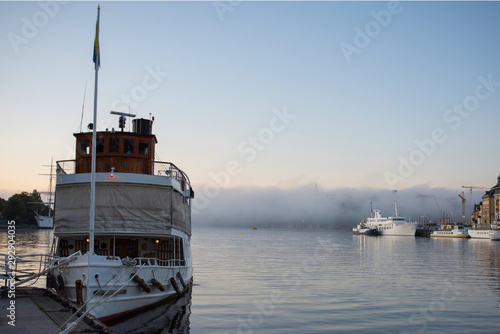 Canvas Print Morning view over Stockholm inner harbour with boats, canoes, piers and islands