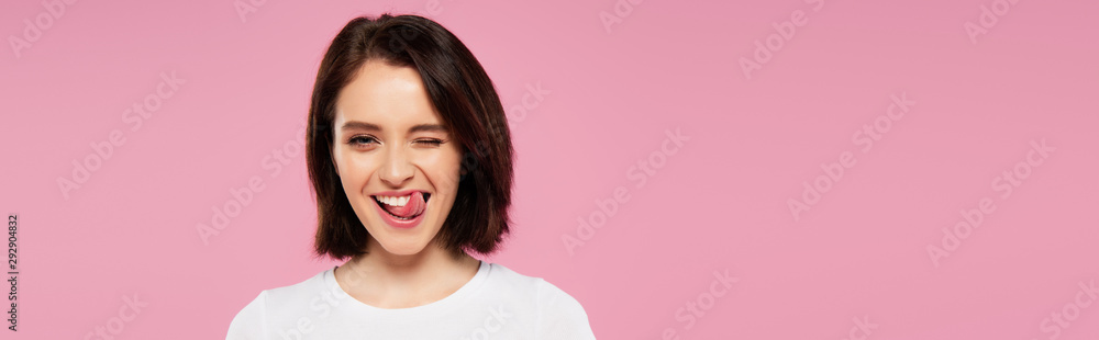 panoramic shot of beautiful girl showing tongue and winking isolated on pink panoramic shot of beautiful girl showing tongue and winking isolated on pink