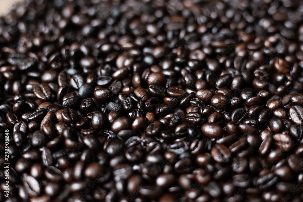 Roasted arabica coffee bean on wood background Roasted arabica coffee bean on wood background
