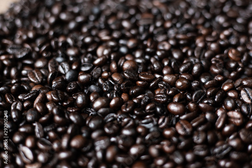 Roasted arabica coffee bean on wood background