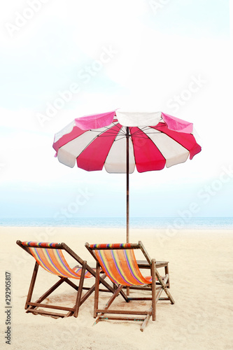 Blue sea and white sand beach with beach chairs and red parasol  Cha-am  Thailand - holiday and vocation concepts. COPY SPACE.