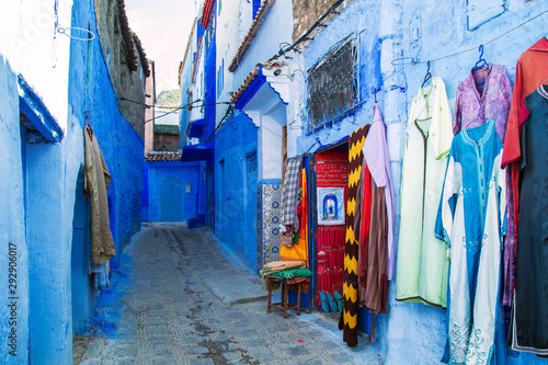 Traditional carpets on the blue Chefchaouen street.