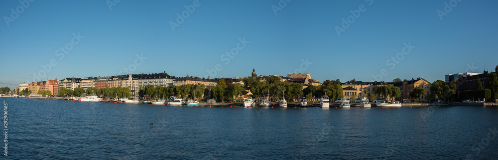 Morning view over Stockholm inner harbour with boats, canoes, piers and islands an autumn day