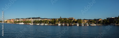 Morning view over Stockholm inner harbour with boats  canoes  piers and islands an autumn day