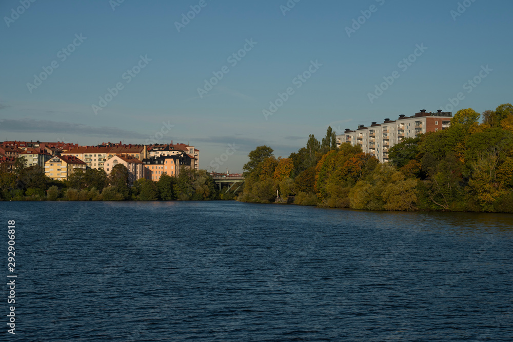 Morning view over Stockholm inner harbour with boats, canoes, piers and islands an autumn day Morning view over Stockholm inner harbour with boats, canoes, piers and islands an autumn day