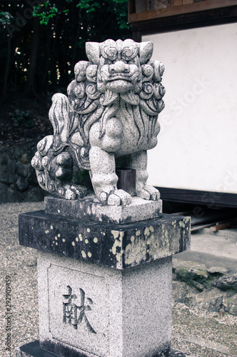 Guardian lion dog statue at a Japanese shrine (translation: 