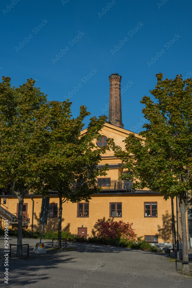 Fototapeta premium Buildings in Stockholm inner harbour an autumn