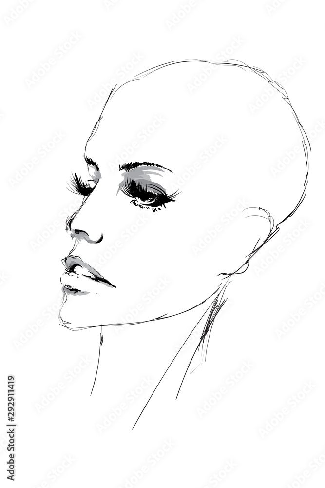 Beautiful young woman with bald head and expressive look. Fashion