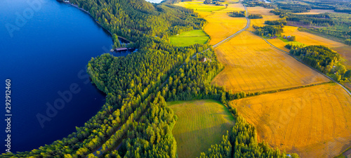 Aerial view of Pulkkilanharju Ridge, Paijanne National Park, southern part of Lake Paijanne. Landscape with drone. Blue lakes, fields and green forests from above on a sunny summer day in Finland. photo