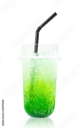 Kiwi fruit italian soda drink in glass with straws.