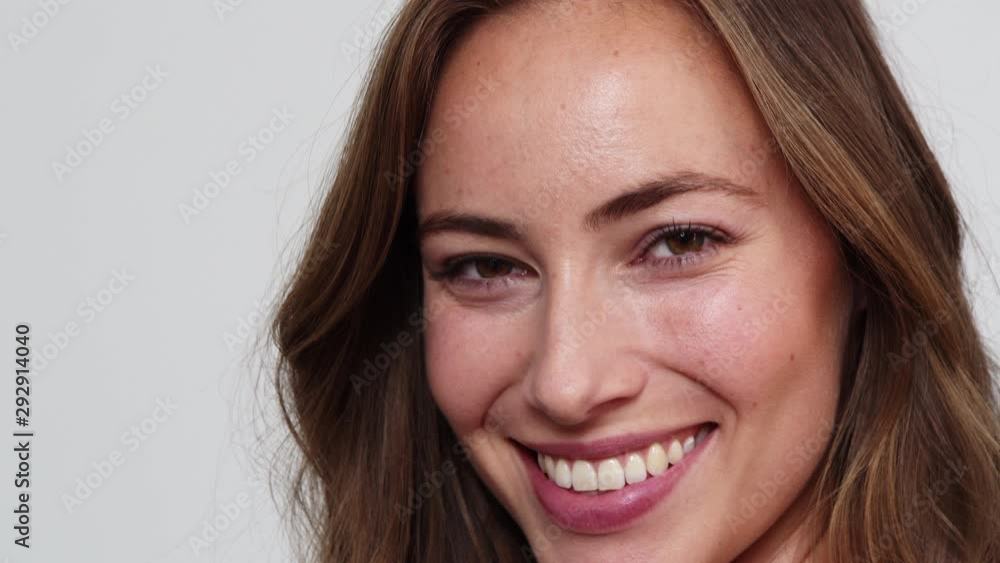 Headshot of a Model with Brown Eyes Smiling for the Camera Headshot of a Model with Brown Eyes Smiling for the Camera
