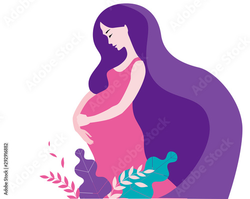 A pregnant woman with long hair stands among the flowers.