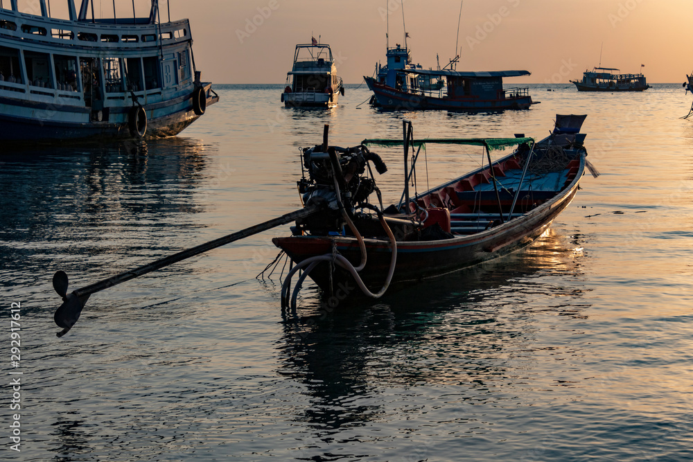 Sunset with a boat on the shore