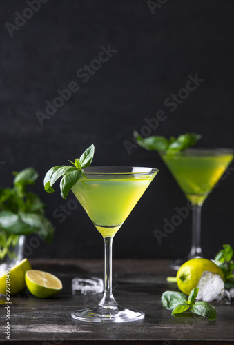 Gimlet cocktail with fresh basil leaves