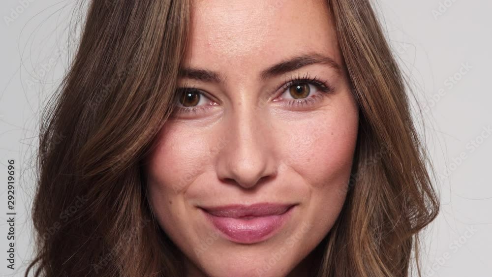 Pretty Model with Brown Eyes Looking Straight at the Camera and then Smiles Pretty Model with Brown Eyes Looking Straight at the Camera and then Smiles