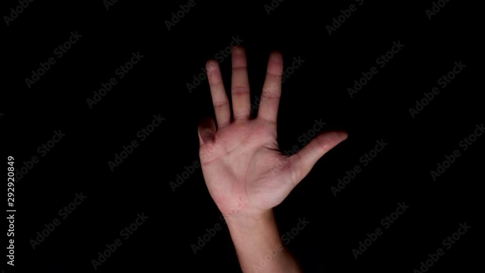 Caucasian Hand Coming Up And Showing Number Four Sign Isolated On Black background. Close-up potrait shot. Caucasian Hand Coming Up And Showing Number Four Sign Isolated On Black background. Close-up potrait shot.